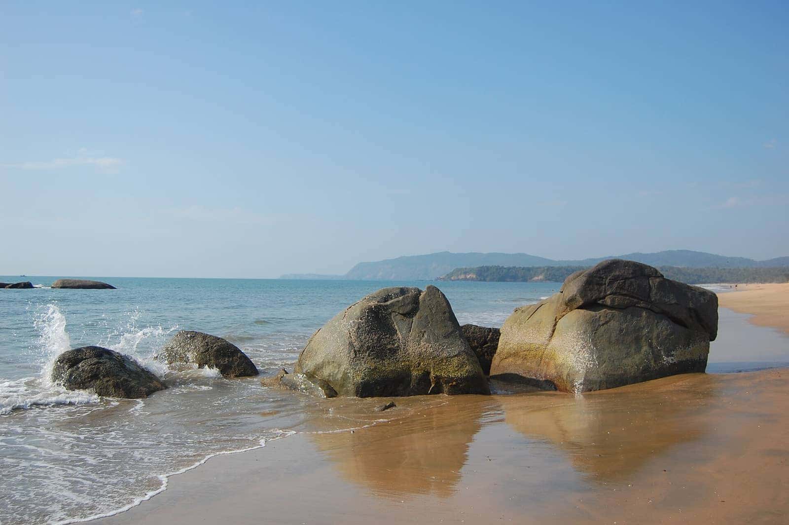 Smooth boulders on the shoreline at Palolem Beach, South Goa