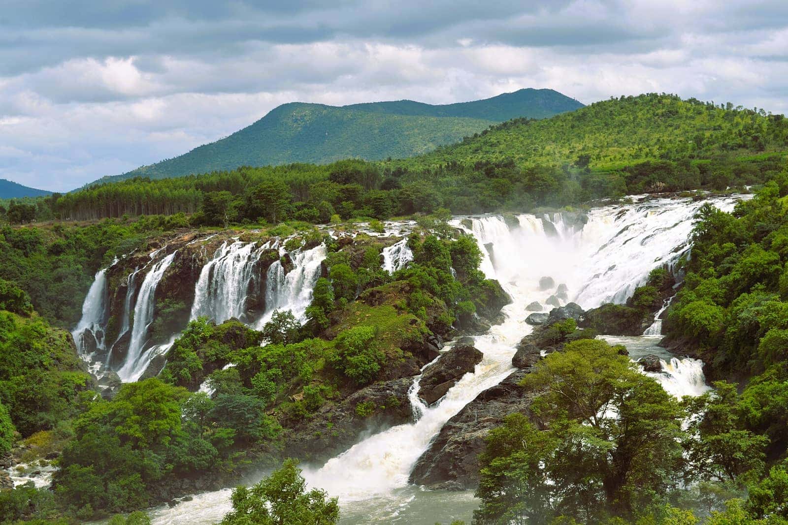 Shivanasamudra Falls on the Kaveri River framed by green hills