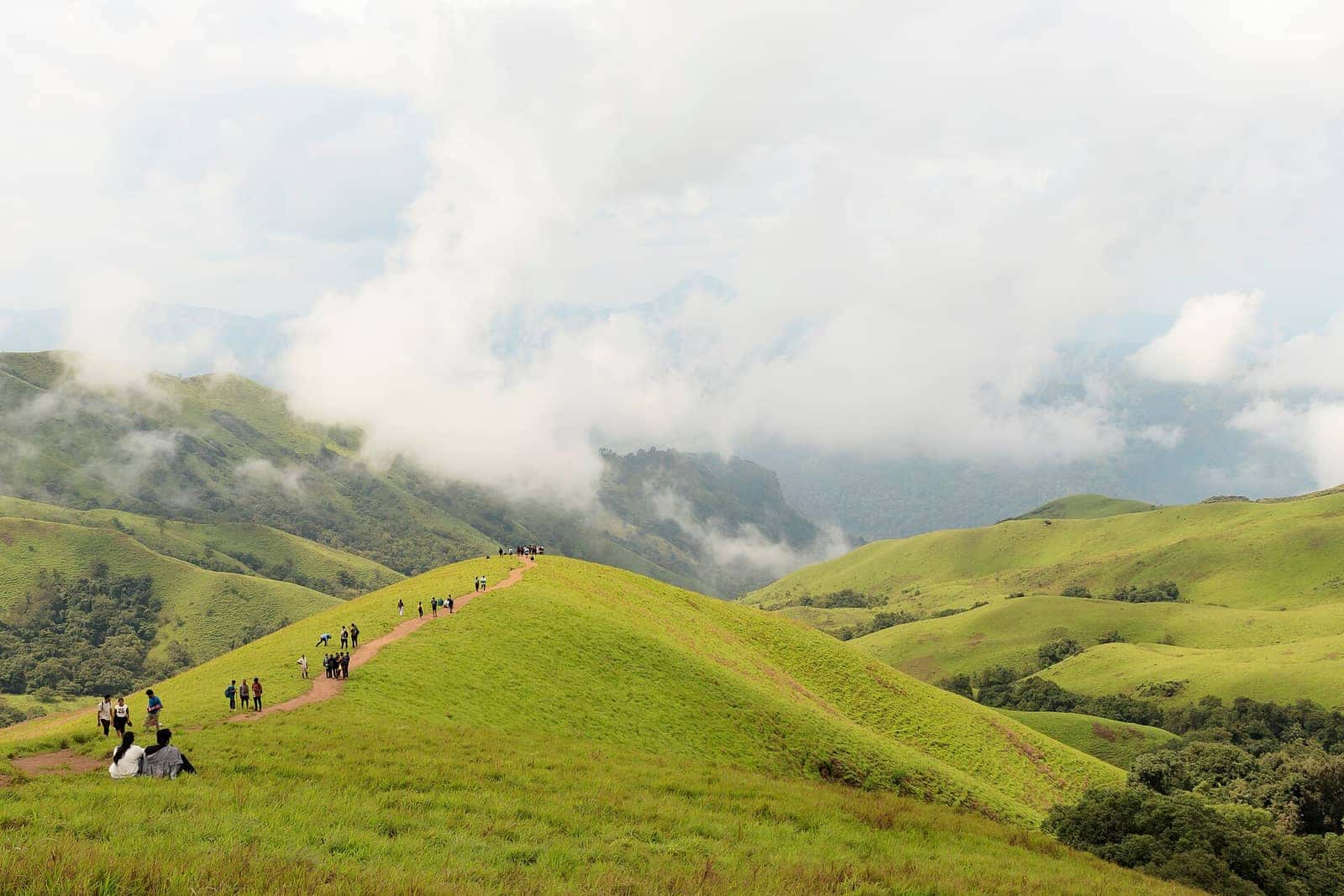 Trekkers following the ridge trail on Netravati Peak, Kudremukh