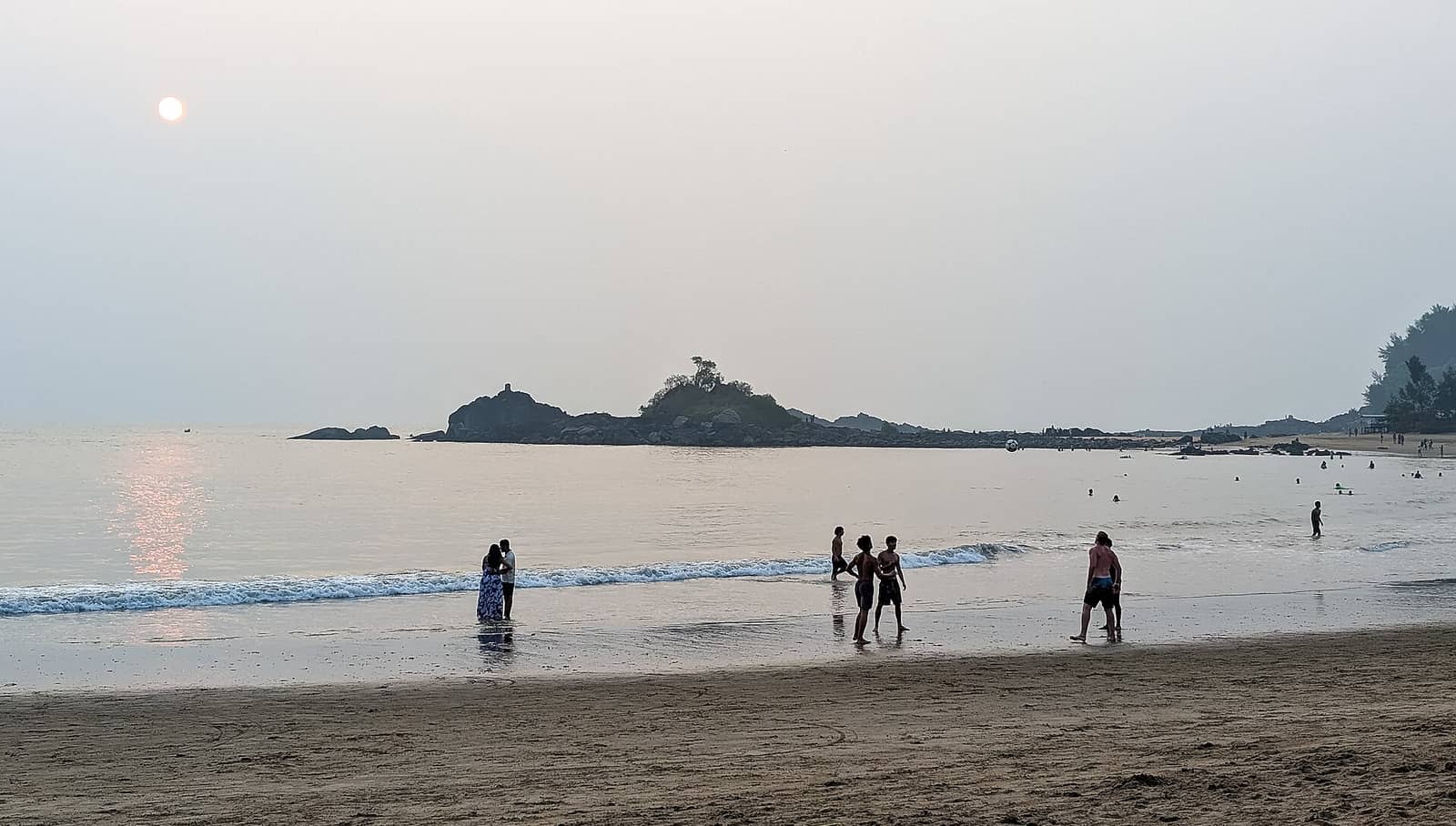 Evening at Om Beach in Gokarna with a rocky islet offshore