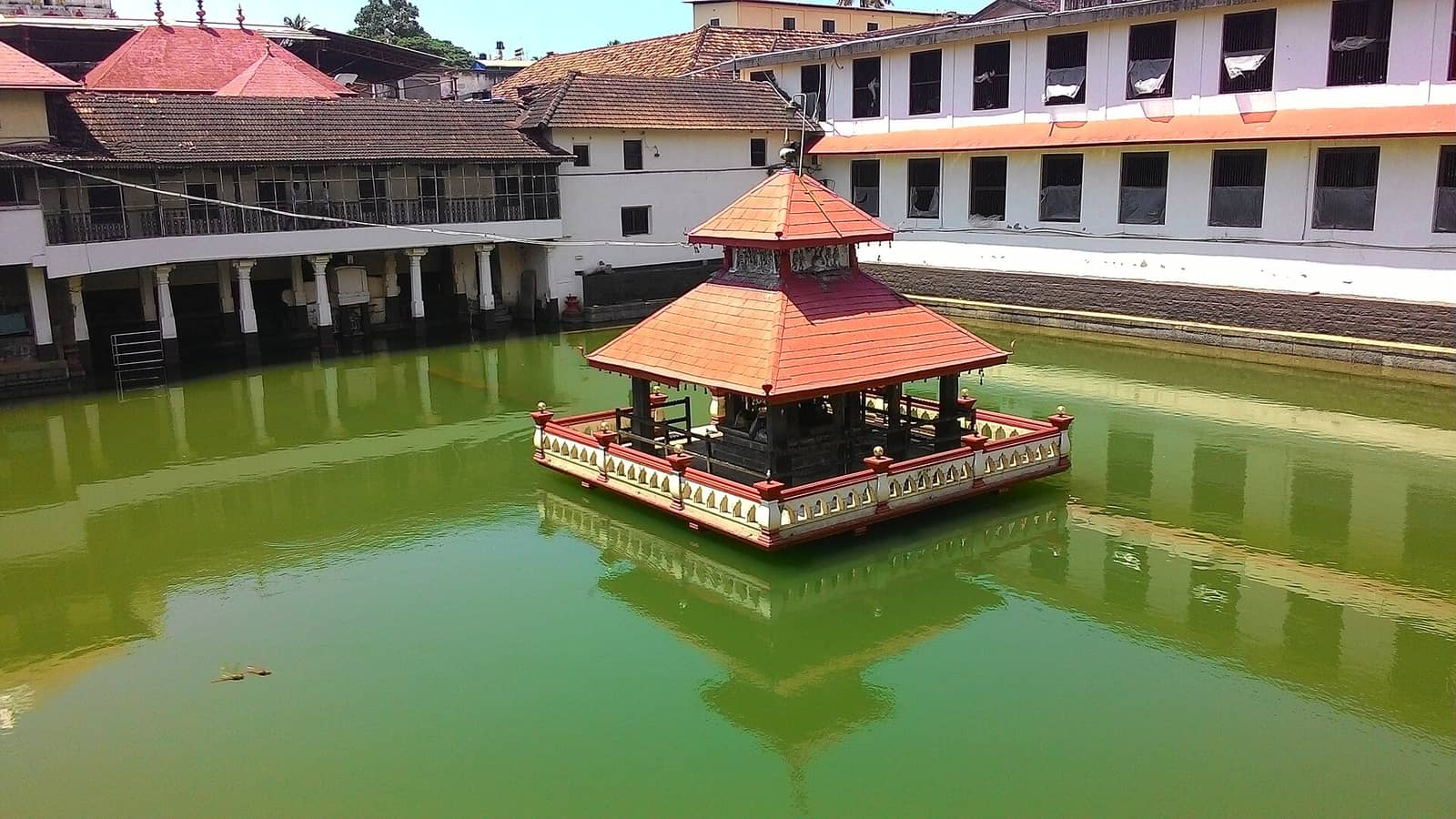 Temple pond with a tiled pavilion at the Sri Krishna Matha in Udupi
