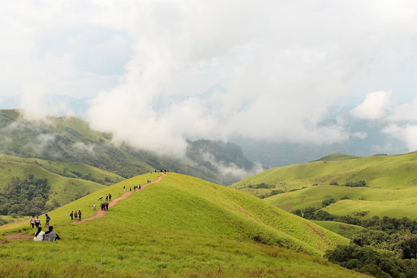 Trekkers following the ridge trail on Netravati Peak, Kudremukh